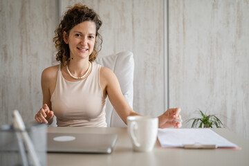 One young business woman entrepreneur sitting in the office working