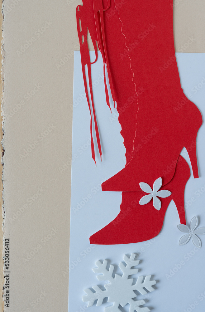 Sticker paper flower, foam snowflake, and glyph or dingbat cutout of tall lace up stiletto boots