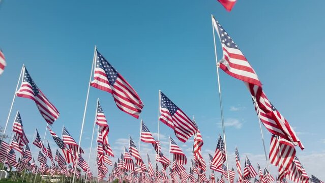 Drone footage of flags for each victim lost their lives in terrorist attacks. Waves of Flags display at Pepperdine University serving as a Sept. 11, 2001 remembrance. High quality 4k footage