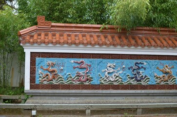 HAREN, NETHERLANDS - MAY 23, 2022: View of Nine-Dragon wall in Chinese garden