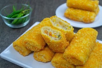 Risoles bihun or rissole with vermicelli noodle filling served on white plate. snacks that are cooked by frying, have a savory taste