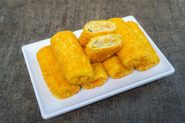 Risoles bihun or rissole with vermicelli noodle filling served on white plate. snacks that are cooked by frying, have a savory taste