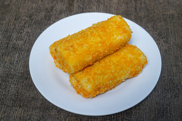 Risoles bihun or rissole with vermicelli noodle filling served on white plate. snacks that are cooked by frying, have a savory taste