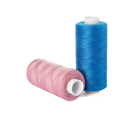 Different colorful sewing threads on white background