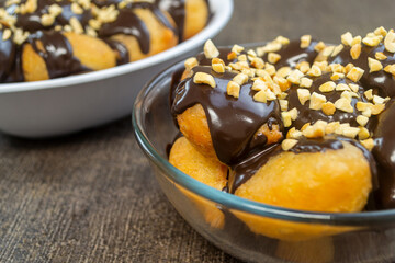 Loukoumades (Greek Donuts) or donat yunani combined with melted chocolate topping, have a crunchy texture on the outside and soft on the inside.