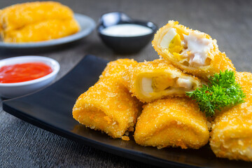 risol mayo or mayonnaise risole. food containing boiled eggs, sausage and mayonnaise sauce wrapped in risole skin and breadcrumbs, cooked by frying. has a savory taste