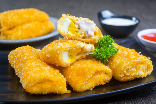 risol mayo or mayonnaise risole. food containing boiled eggs, sausage and mayonnaise sauce wrapped in risole skin and breadcrumbs, cooked by frying. has a savory taste