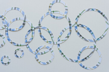 blue plaid paper rings on blank paper