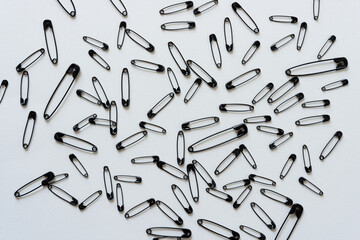 background with black safety pins 