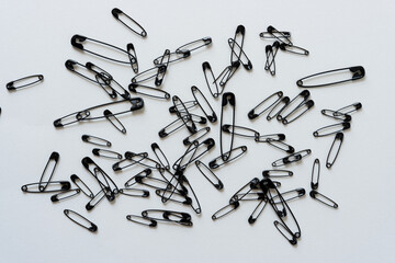 background with black safety pins