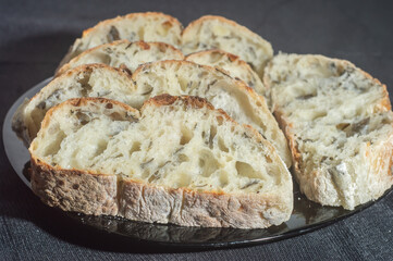 Handmade bread with natural fermentation placed on a black dish