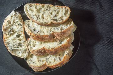 Handmade bread with natural fermentation placed on a black dish