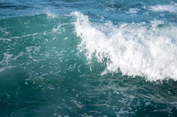 Fototapeta na wymiar Closeup of an Ocean Wave Breaking on the Shore.