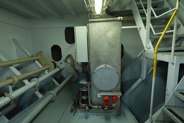 Cruise ship engine room interior with water tight doors electrical and diesel engines, water pipes,...