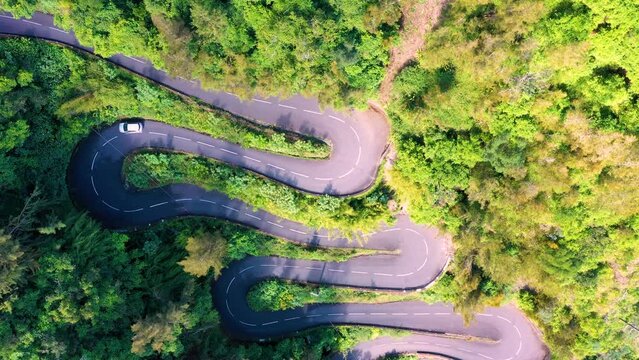 Aerial view of an S-curve road up to Cilaos, Cirque de Cilaos, Reunion Island.
