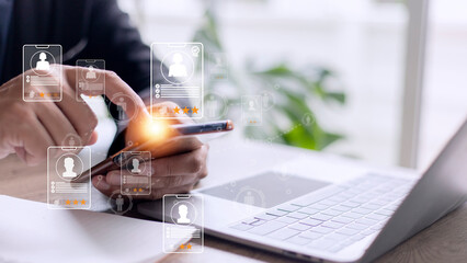 Online recruitment application specialist search service concept with virtual cards with rating and profile information on a smartphone in hand.
