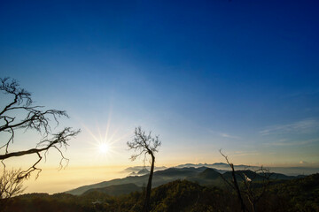 Fototapeta na wymiar Silhouette of highlands with dawn sunlight background