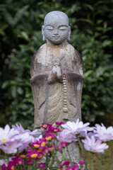 statue of buddha in a japanese garden