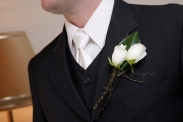 Closeup photo of groom wearing boutonniere