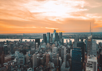 sunset skyline Manhattan views buildings skyscrapers sky clouds color orange panorama jersey city 
