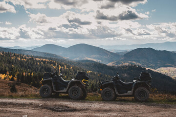 ATVv offroad in mountains during autumn sunny day © Yurii Kushniruk