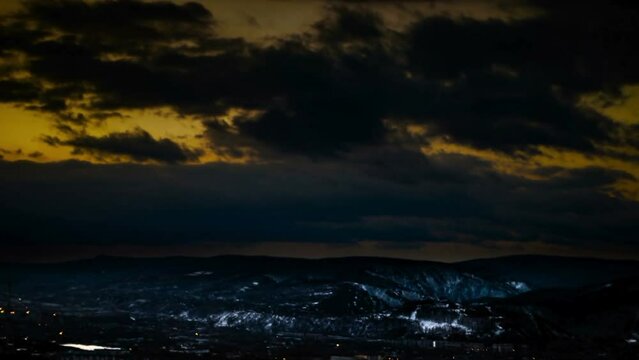 Time lapse Video dawn snowy mountains clouds and sun