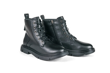 A pair of high leather demi-season boots isolated on a white background.