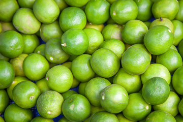 Limes close-up on background in supermarket