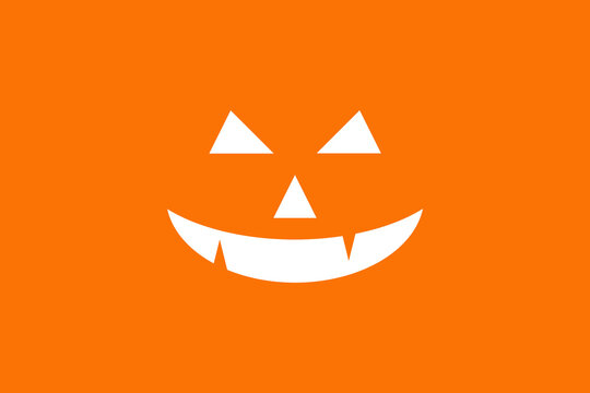 Close up of devil's smile cartoon of Halloween pumpkins in white color on orange background. Template for background and fabric