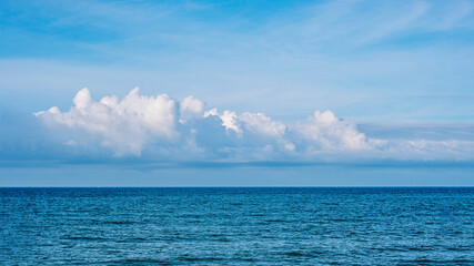 BANNER Atmosphere long panorama real photo beautiful summer white cloud clear blue sky horizon line calm sea. Concept paradise life. Design relax wallpaper background. More tone format in stock