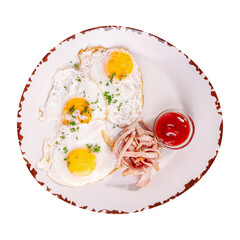 Plate of fried eggs breakfast with ketchup