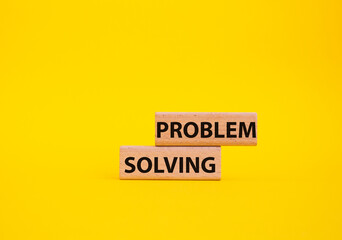 Problem solving symbol. Concept word Problem solving on wooden blocks. Beautiful yellow background. Business and concept. Copy space