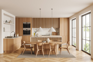 Light kitchen interior with eating zone and countertop, panoramic window