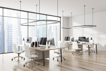 Light office interior with pc computer, desk and panoramic window on city view