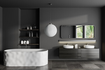 Grey bathroom interior with double sink and tub with shelf