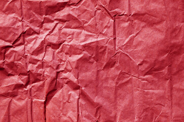 Creative background with scattered overlay of crumpled papers.	