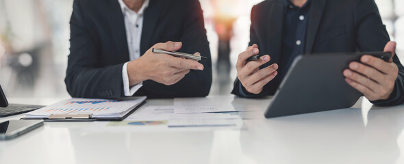 Business professionals. Cropped shot of business people analyzing data using computer while spending time in the office.