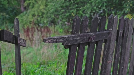 Old Broken Withered Wooden Fence around Private Property