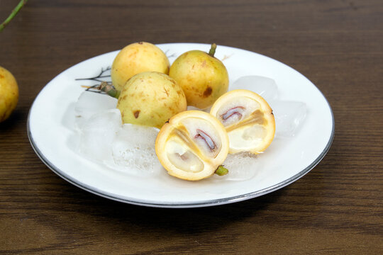 Baccaurea motleyana also known as lotkon isolate on white plate. sweet and sour taste.