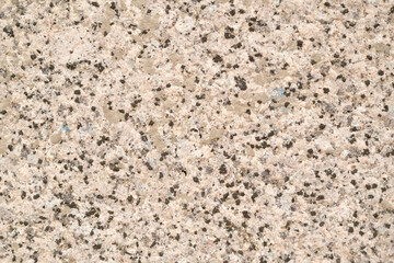 beige granite wall.granite texture closeup.selective focus