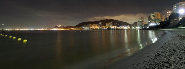 Alicante at night from Albufera beach, Valencian community in Spain. - 533104219