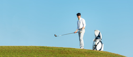 Golfer sport course golf ball fairway.  People lifestyle man approach playing game golf tee off on...