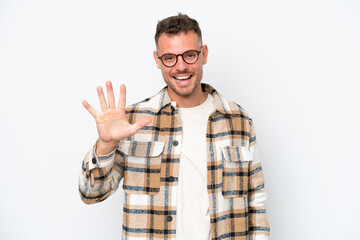 Naklejka premium Young caucasian handsome man isolated on white background counting five with fingers