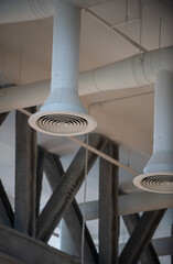 White round air duct. Air Condition pipe line and ventilation system in a school sport hall.