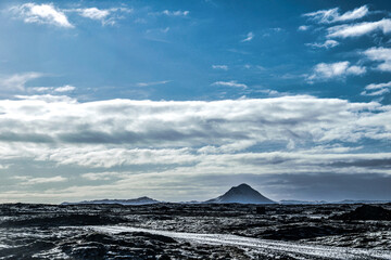Iceland Reykjanesbær sunny cloudy blue sky over vulcanic winter mountain landscape