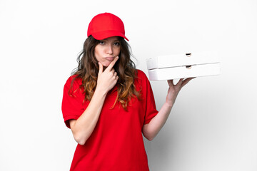 Pizza delivery woman with work uniform picking up pizza boxes isolated on white background thinking