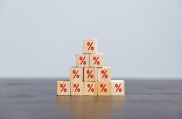 Closeup wood cubes with percentage symbol, business interest, discount investment, financial...