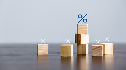Closeup wood cubes with percentage symbol, business interest, discount investment, financial...