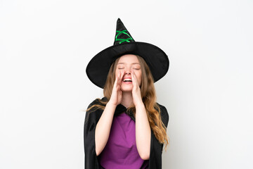 Young pretty woman costume as witch isolated on white background shouting and announcing something