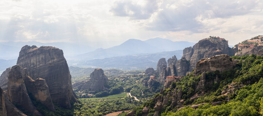 Panoramic view of the Meteora valley with impressive rocks and 4 famous monasteries, a few...
